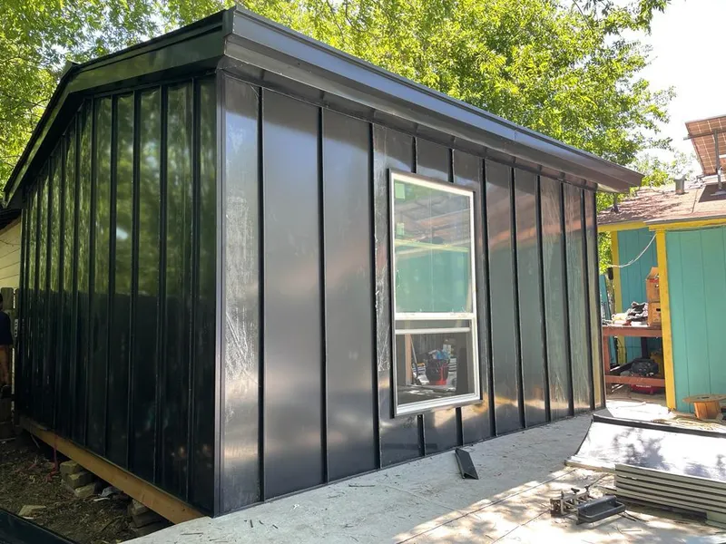 Black standing seam metal wall panels for Roof Inspection in Palatka