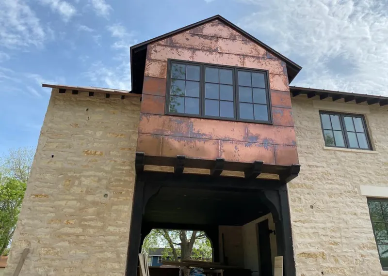 Copper metal panel facade on a stone building for Metal Roof Coating in Palatka
