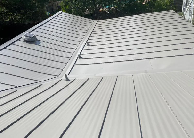 Solar attic fan installed on a metal roof for Roof Ventilation in Palatka